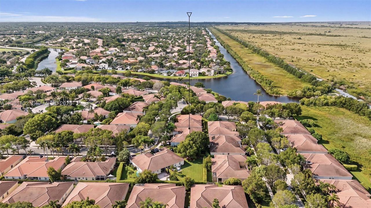 Sweeping aerial view capturing the community's picturesque waterways.