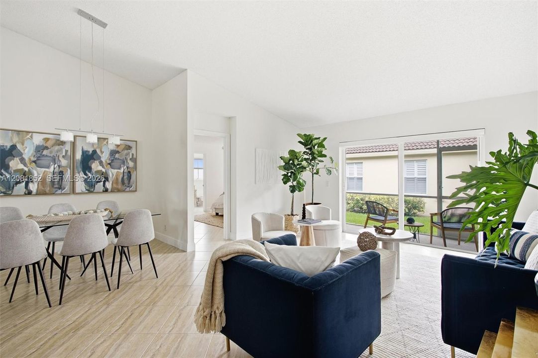 Spacious living area with sliding glass doors framing the private lanai.