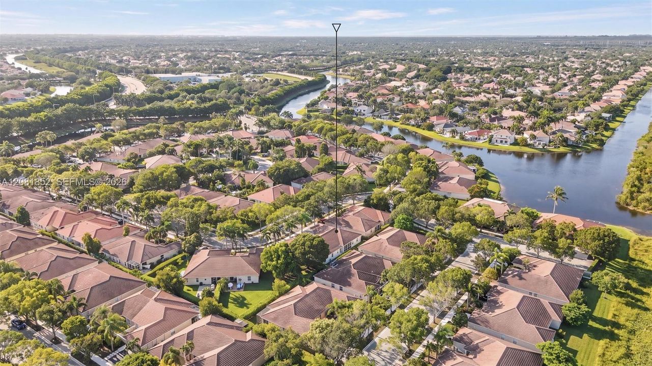 Aerial view capturing peaceful waterway views throughout the neighborhood.