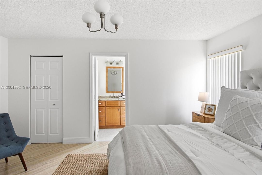 Spacious primary bedroom offering a peaceful retreat at day's end.