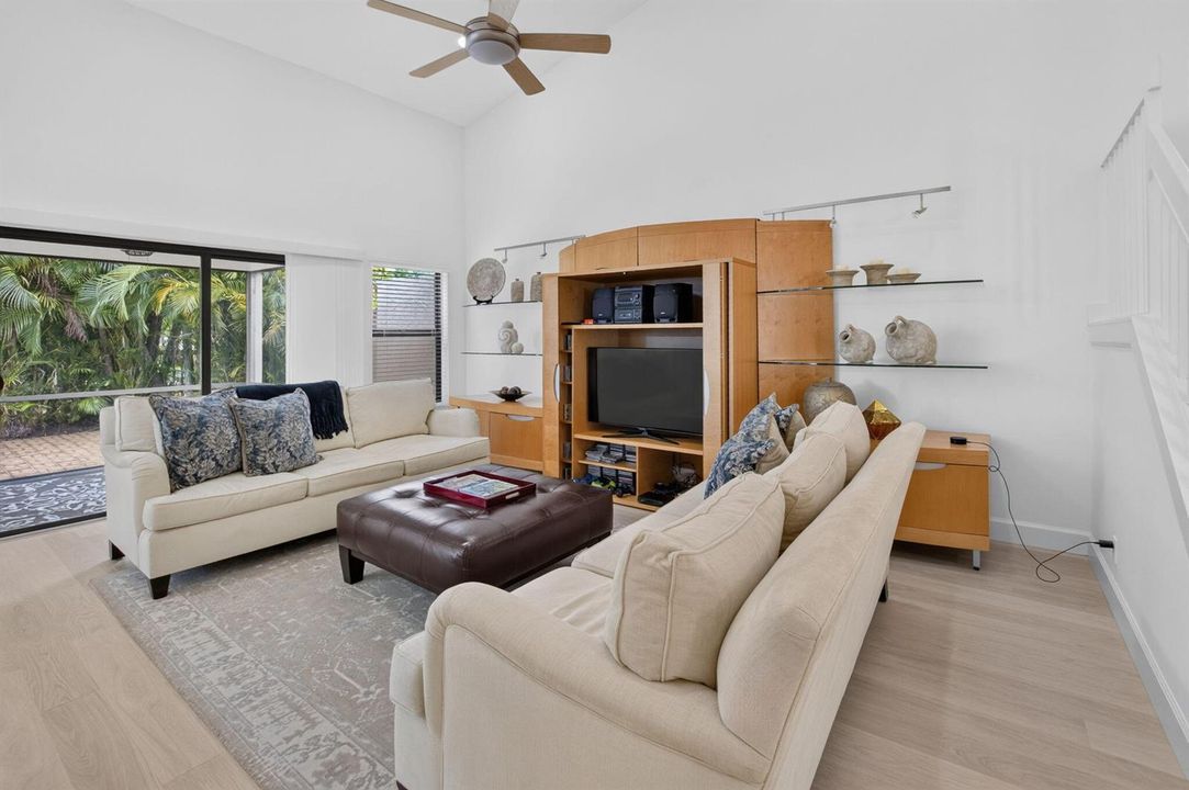LIVING ROOM WITH SLIDERS TO PATIO
