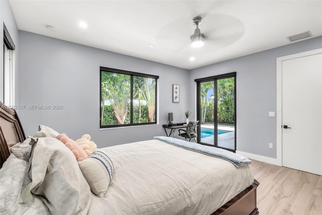 1st floor primary bedroom with exit to pool terrace