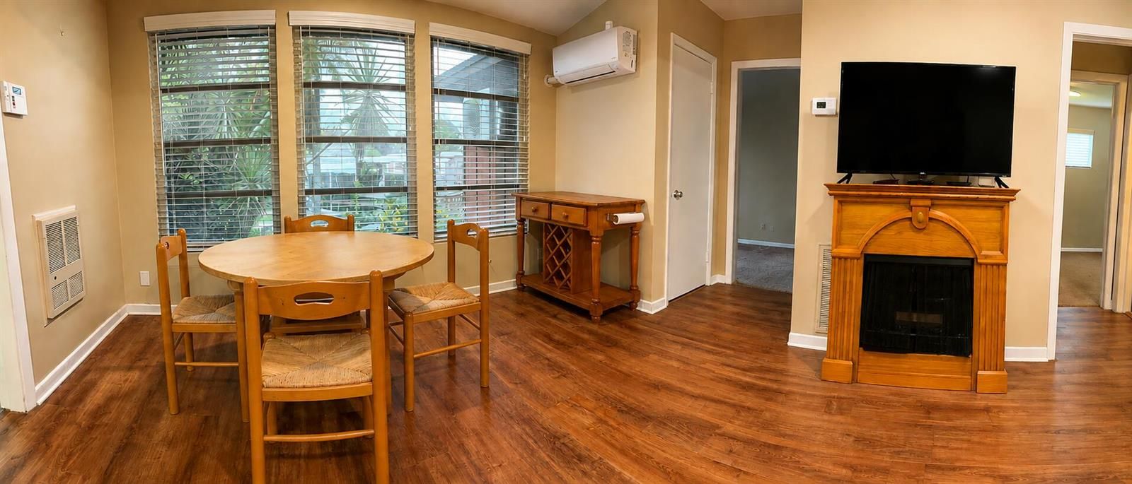Warm Rustic Dining Room with Bay Windows