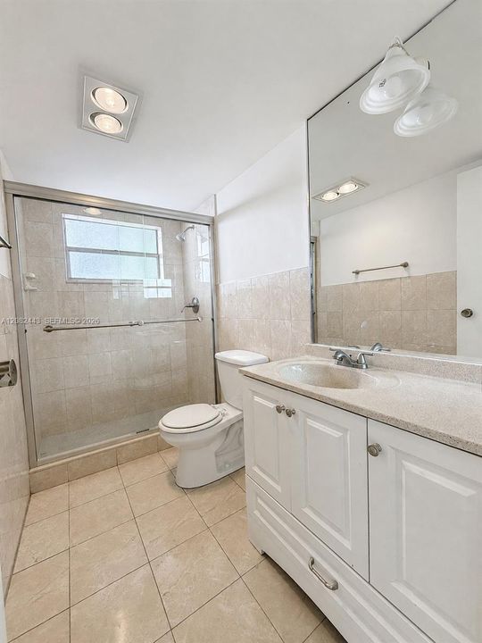 Second bathroom with enclosed shower