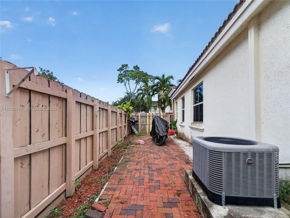 Side yard with gated entrance
