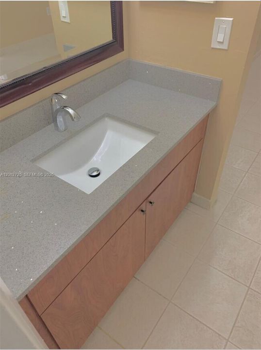 The image illustrates the Primary Suite Bathroom.
