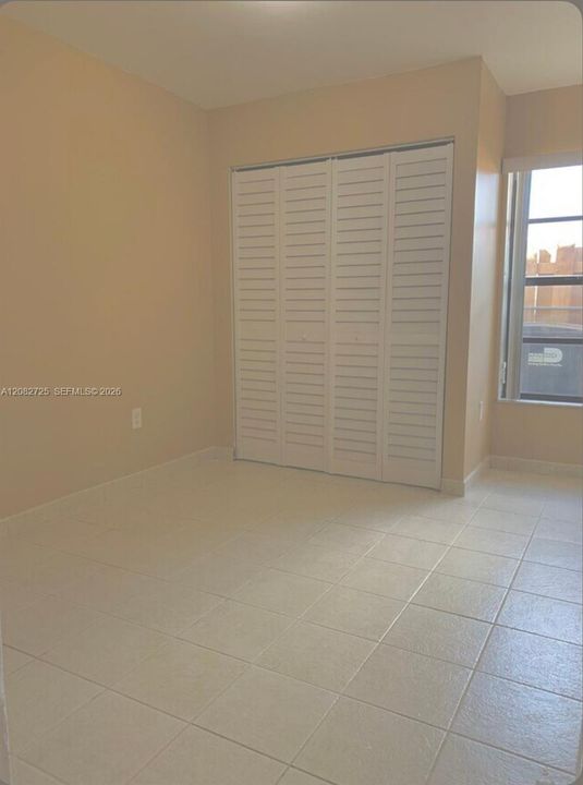 1 of 2: Photographs depicting the second bedroom.