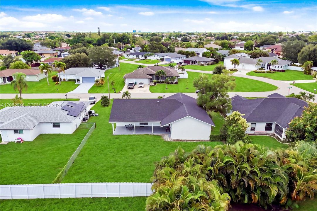 Welcome to 256 SE Santa Barbara Pl, a WELL-MAINTAINED 3 BED + 2 BATH home combining MODERN CONTEMPORARY FINISHES, extensive improvements, exceptional indoor/outdoor living & a HUGE BACKYARD!