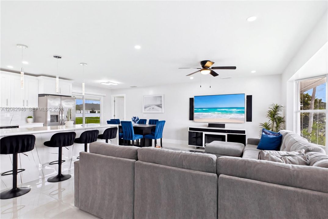 Spacious OPEN-CONCEPT living room is bright, modern & designed for comfortable everyday living.