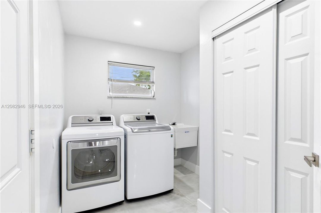 Convenient INDOOR LAUNDRY AREA features LG WASHER + DRYER, a utility LAUNDRY TUB & dedicated space for added everyday functionality and convenience.