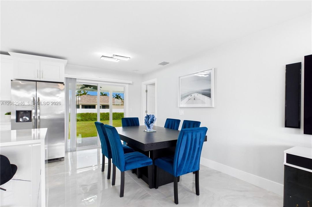 Bright DINING AREA flows seamlessly between the kitchen & living room for effortless everyday living & entertaining.