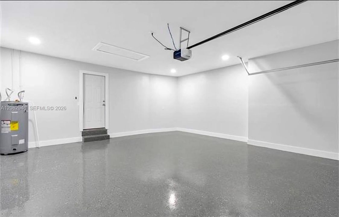 The GARAGE features EPOXY FLOORING & upgraded lighting