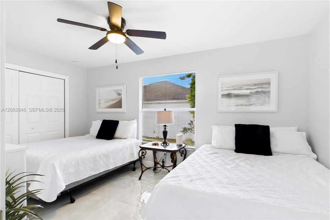 Exceptionally SPACIOUS SECOND BEDROOM offers impressive room for oversized furnishings, a sitting area or workspace while maintaining a bright, open & comfortable feel.