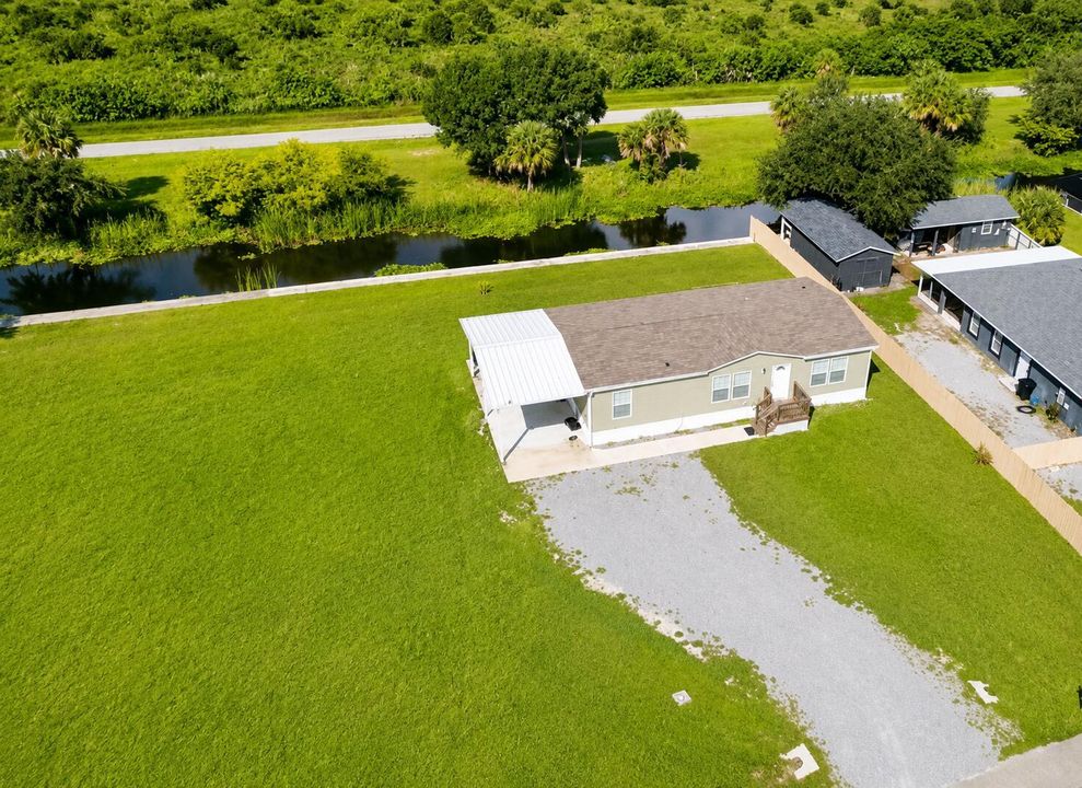 Sunny Aerial View of a Green Country Pro