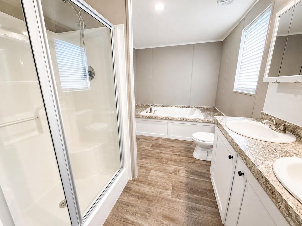 Bright Modern Bathroom with Tub and Vani