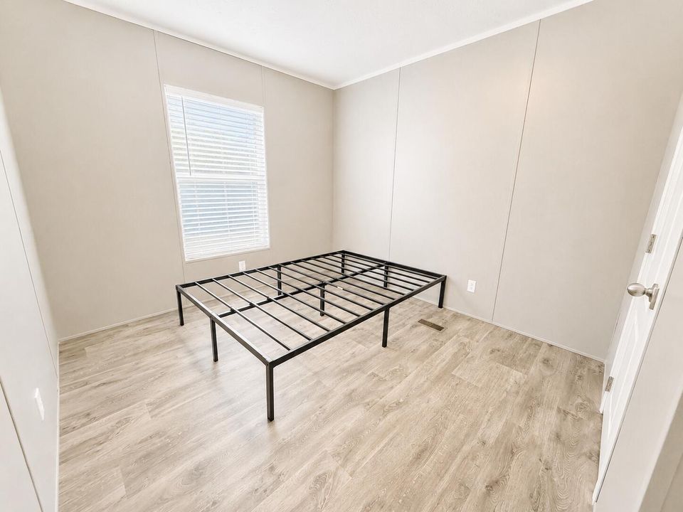 Minimalist Bedroom with Black Bed Frame