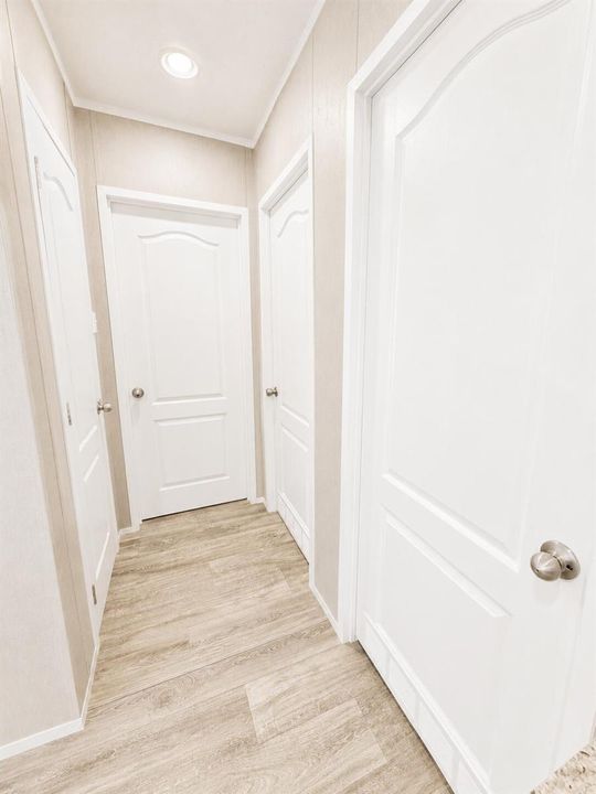 Bright Neutral Hallway with White Panele