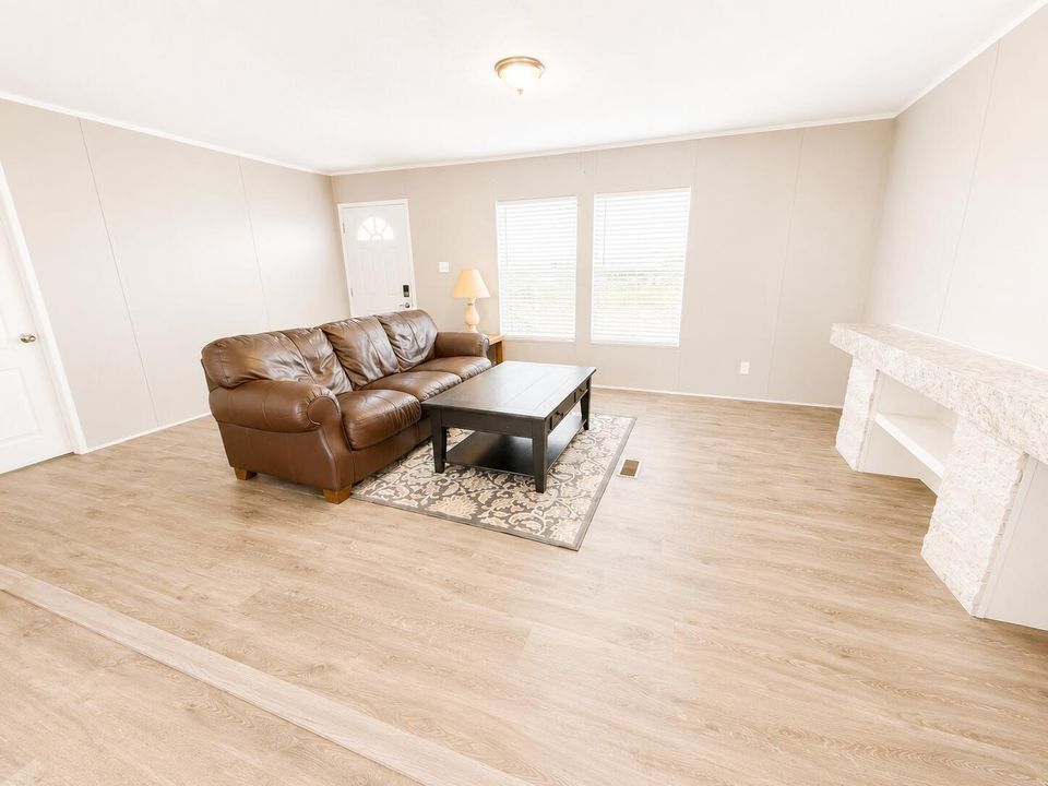 Bright Minimalist Living Room with Leath