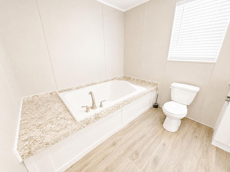 Bright Modern Bathroom with Tub and Toil