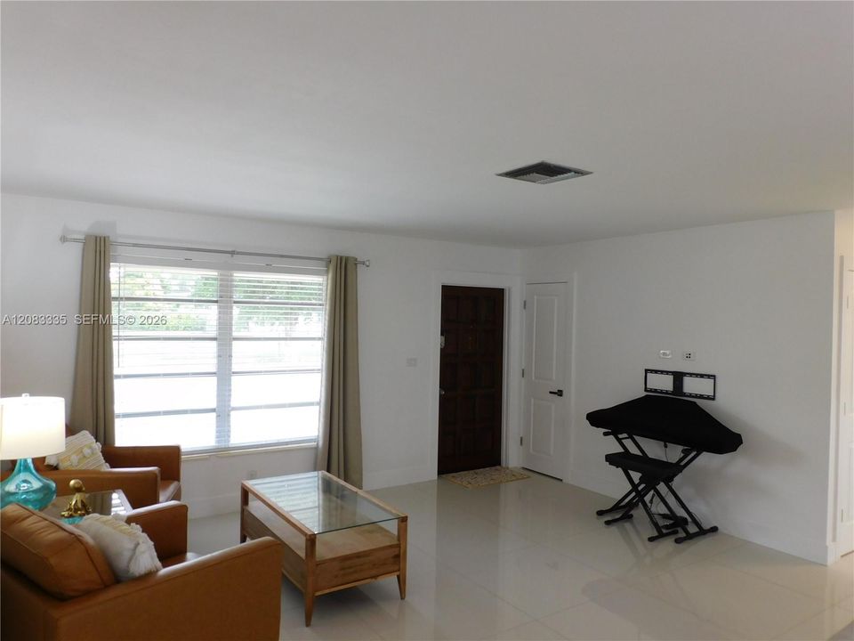 Living room view to entry way.