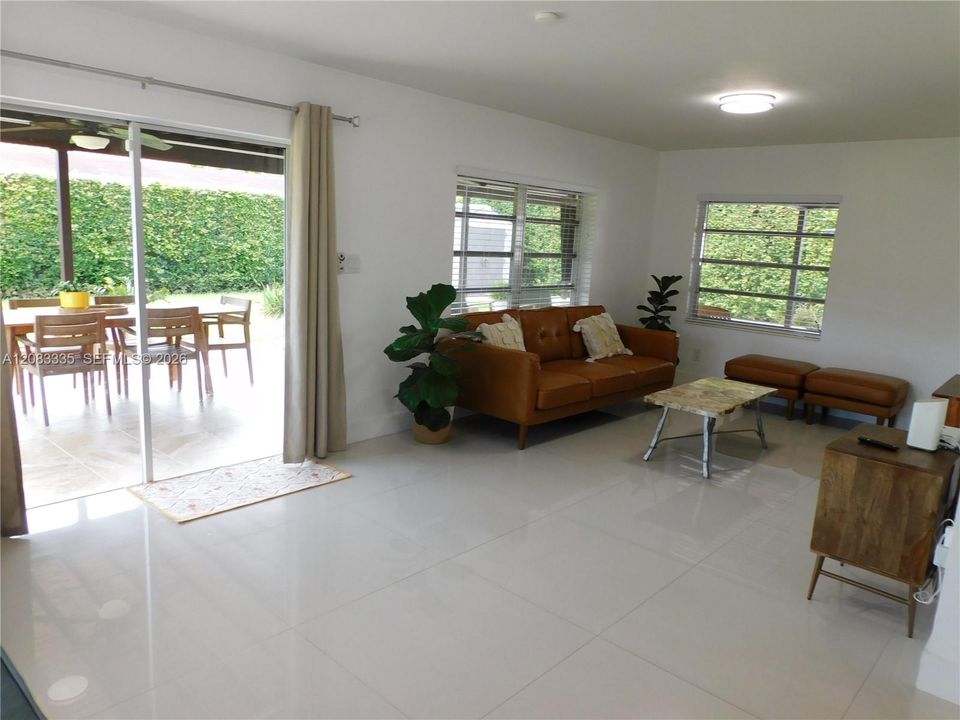 Great Family Room with Easy access to an incredible covered terrace to enjoy South Florida Living.