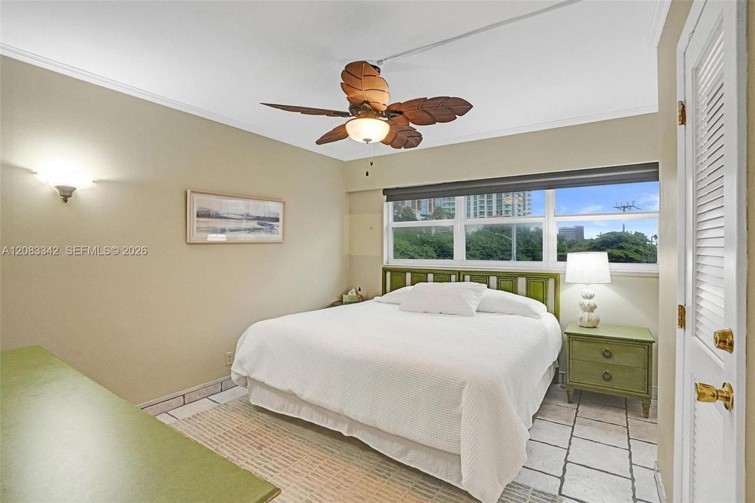 Large bedroom with one of those LARGE  EXTRA WINDOWS we promised you get in this end unit home