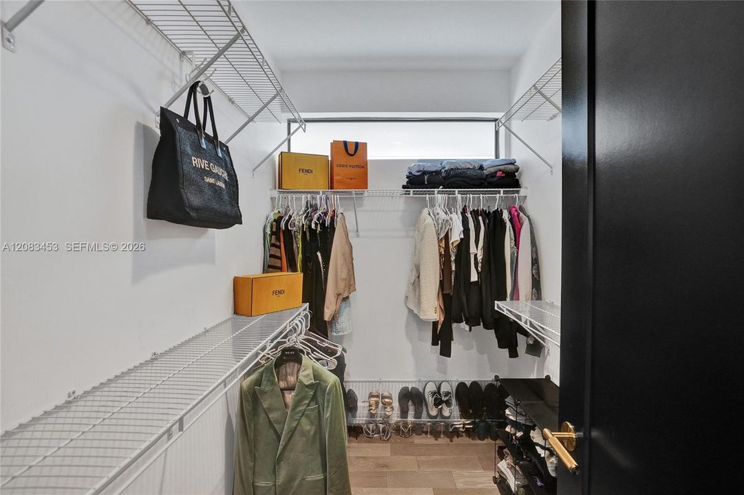 Spacious walk in custom closet