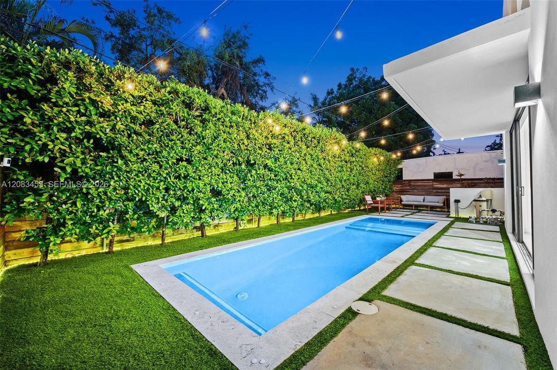 Fully fenced & hedged yard with astro-turf and sparkling salt pool