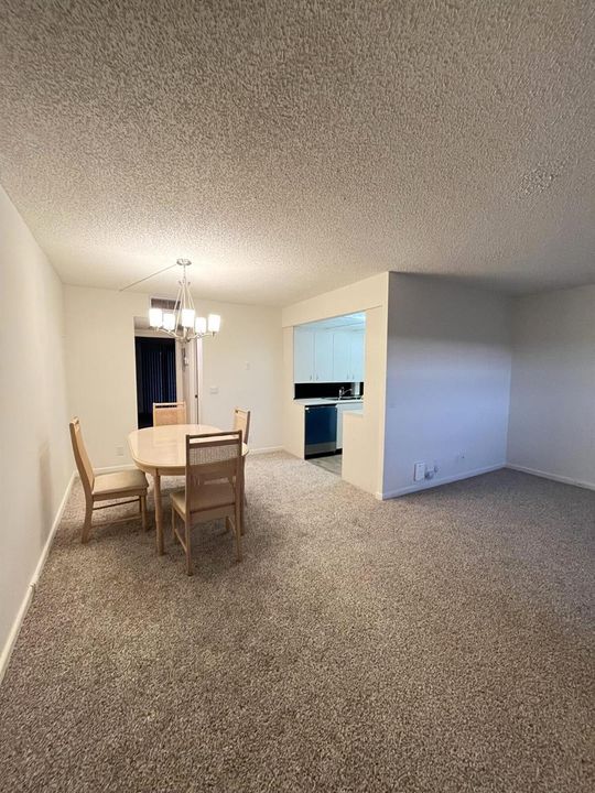 living area facing kitchen and dining
