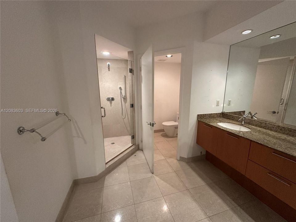 The primary bathroom has a separate toilet room, dual sinks and a walk-in shower.