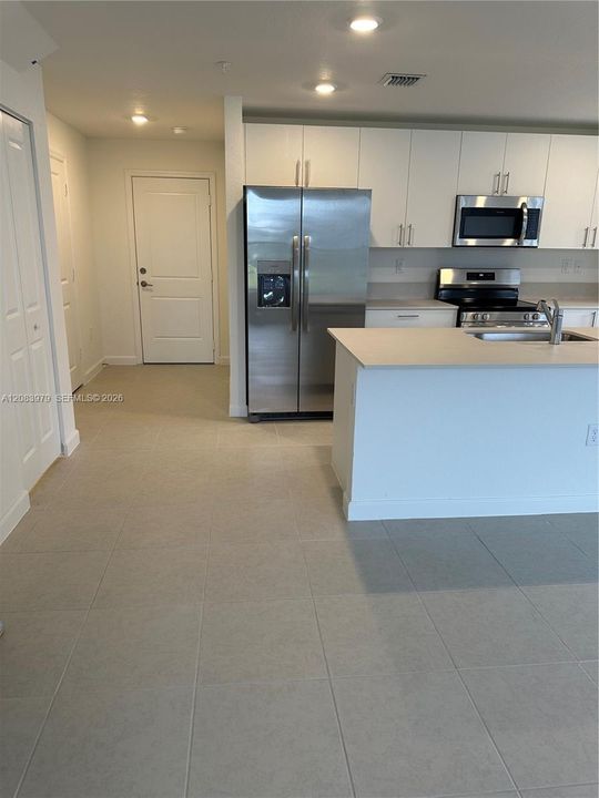 Kitchen and 2nd entrance view