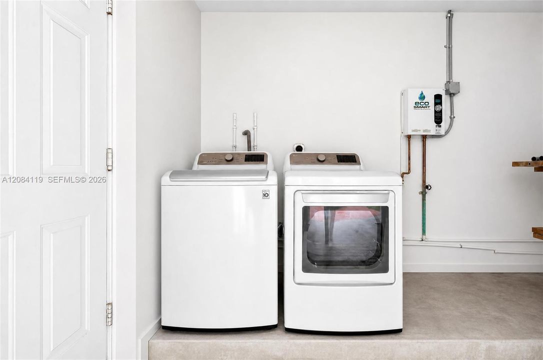 Full size washer and drying inside the garage