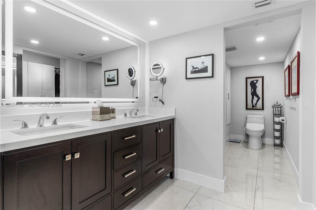 Completely renovated Primary Bathroom with Linen Close, Double Sinks, Designer Mirrors