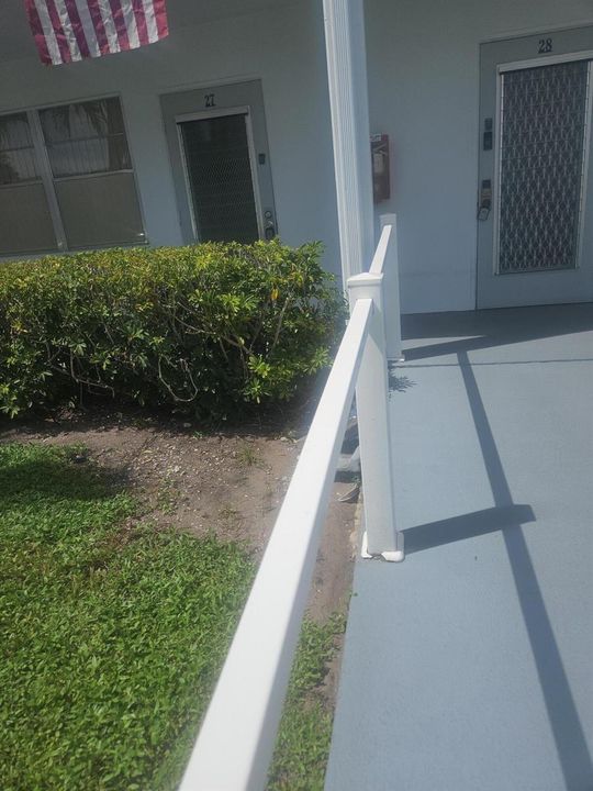 Exterior, walkway to Condo, parking is c