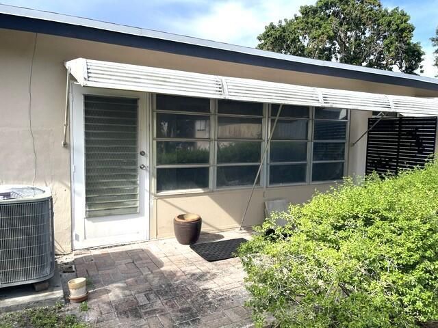 rear exterior view of villa and patio