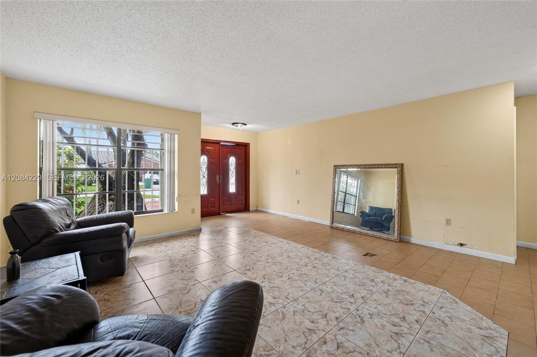 Another living room and foyer view