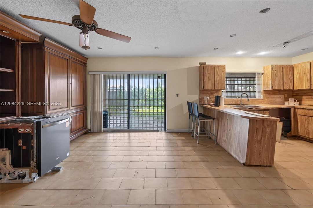Family room area with sliding glass door that leads out to the patio
