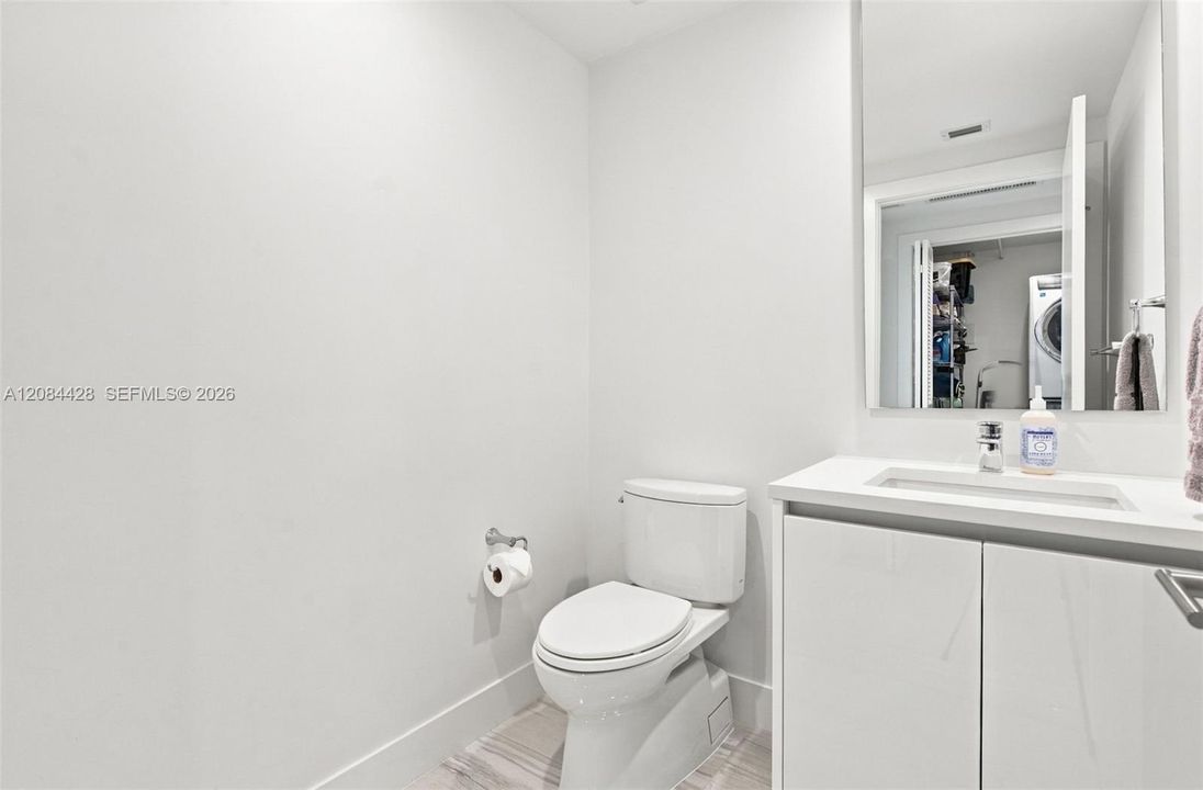 Convenient guest powder room.