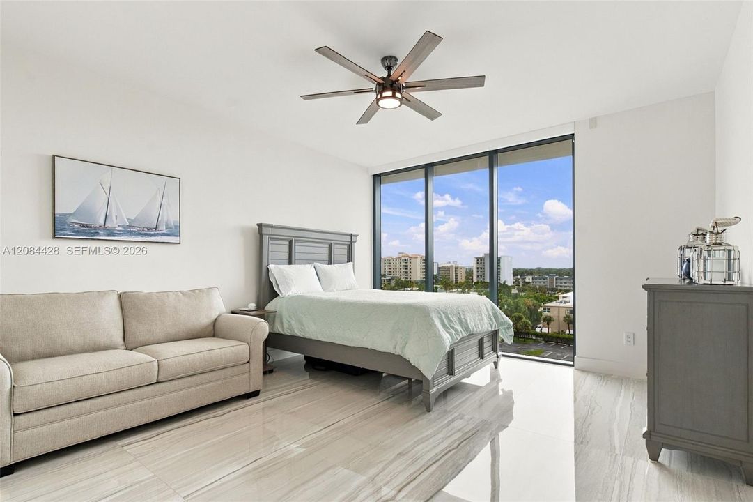 Spacious guest bedroom with a queen-size bed and full-size pullout sofa.