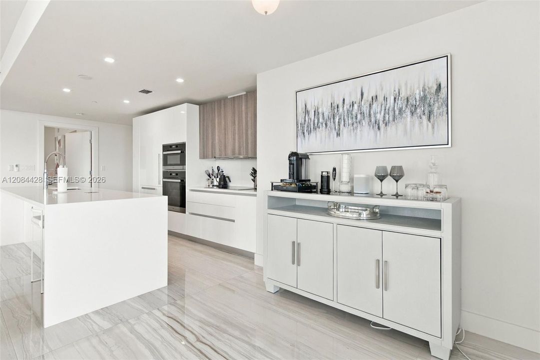 Modern kitchen with sleek cabinetry and built-in appliances.