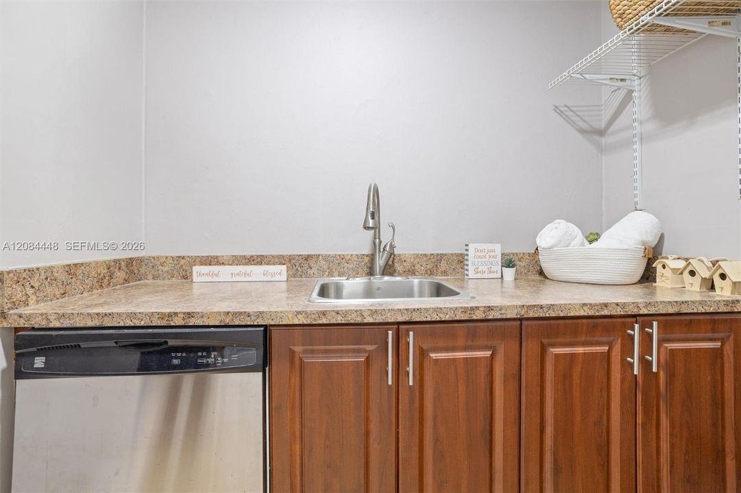 Long countertop with utility sink—perfect for folding, rinsing, or prepping