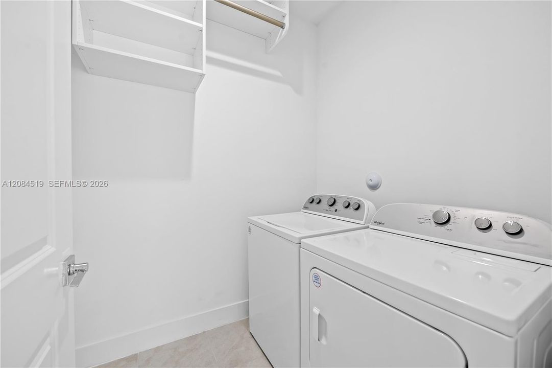 LAUNDRY ROOM SEPARATE SPACE WITH BUILTIN SHELVES STAYS