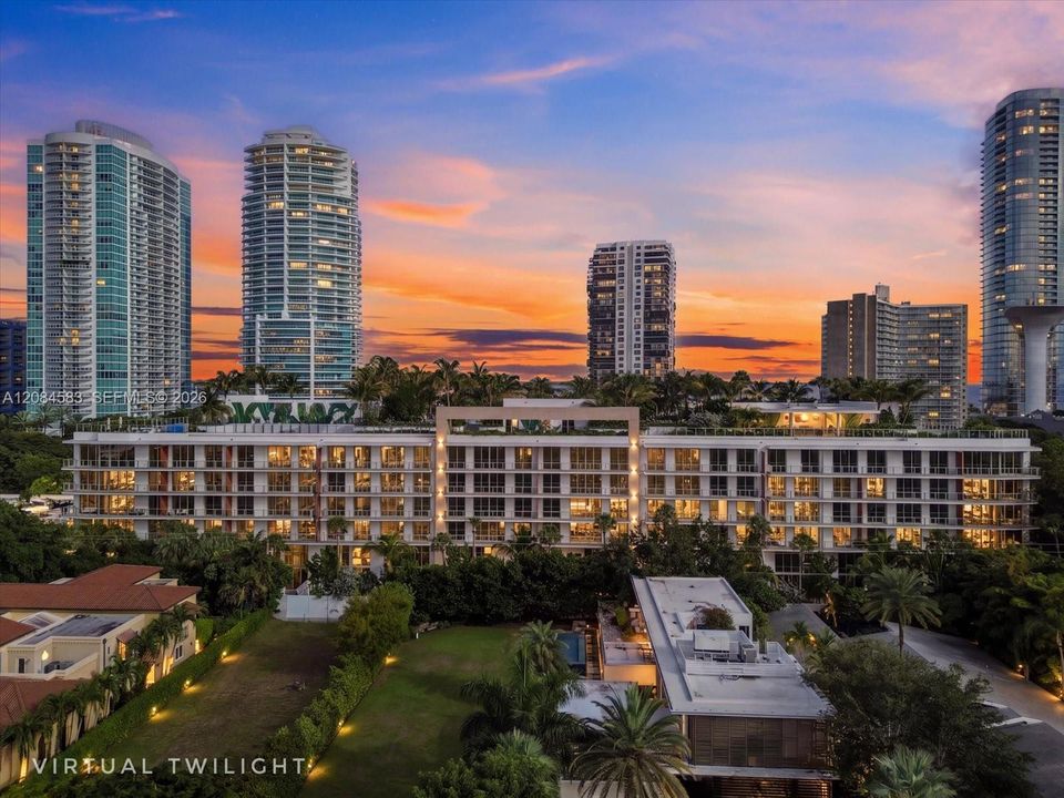 2200 Brickell at sunset with the Brickell skyline beyond - virtual twilight