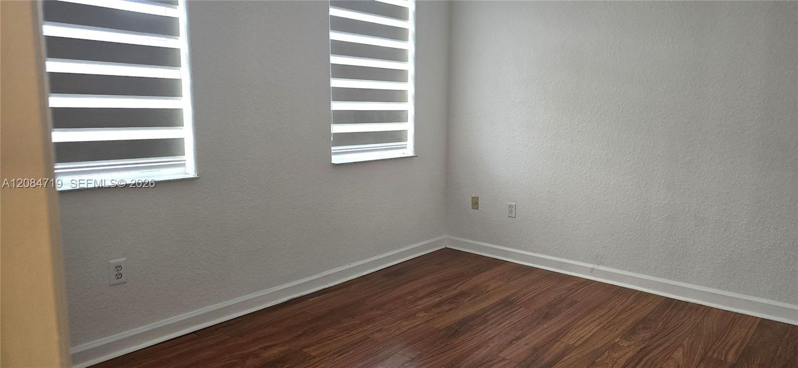 The bedroom features a closet and access to a shared Jack and Jill' bathroom.