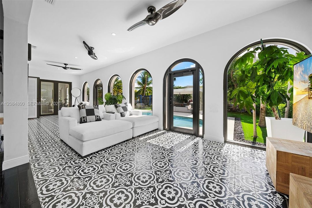 An extended wing provides additional living space with a TV area and separate laundry room
