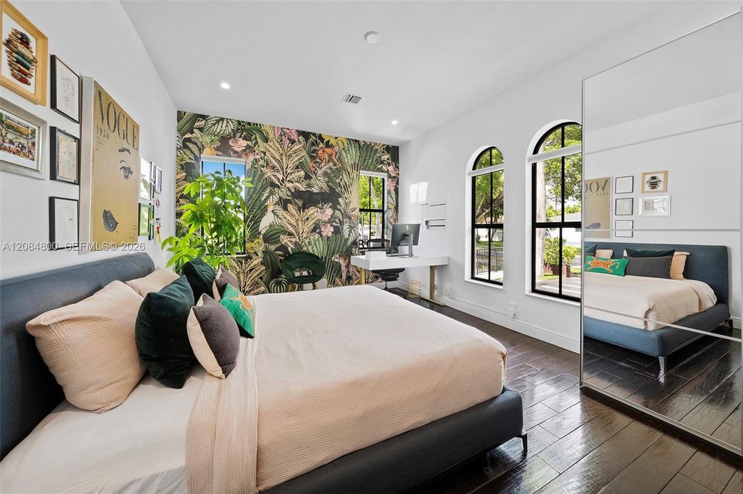 a light-filled corner bedroom with windows on two sides.