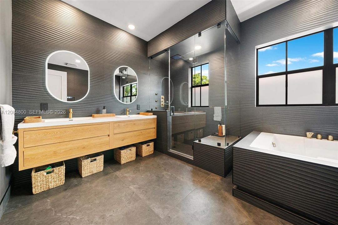 Beautifully remodeled bath with dual vanities,