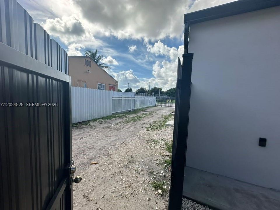 Gate to the driveway on the right