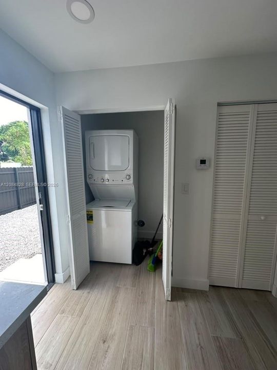 Washer and dryer behind kitchen