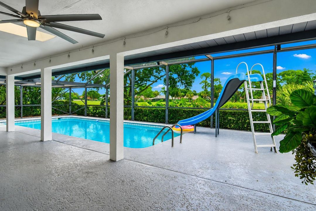 covered lanai with pool and canal view